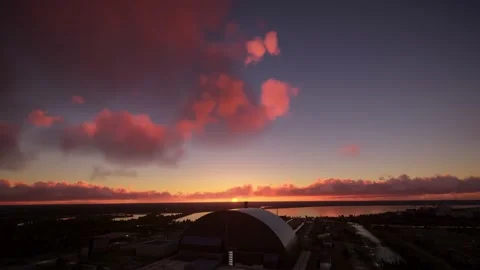 Aerial flight at sunset of the Chernobyl Nuclear Power Plant sarcophagus Video stock 204713232