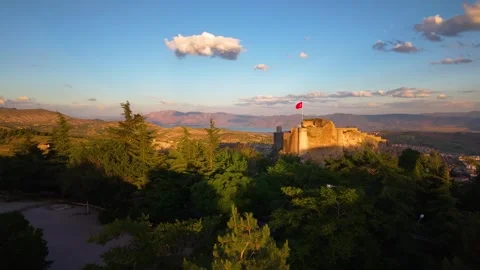 Aerial Flight Through Forest Trees Toward Ancient Castle at Golden Sunset Vídeos de archivo 339665025