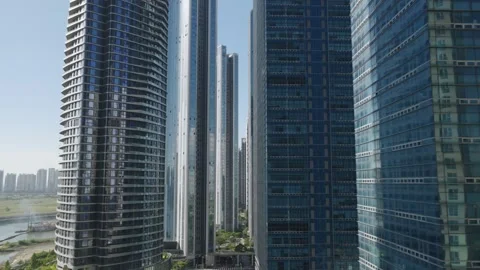Aerial Flight Through the Heart of Songdo International Business District Stock Footage 343828451