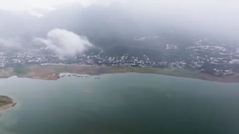 Aerial Flight Through Mist Over Lake with Real Rain Droplets on Lens Stock Footage 322099445