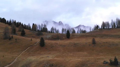 Aerial flight through mountain range in Dolomites, Italy. UHD outdoor footage Stock Footage 98306856