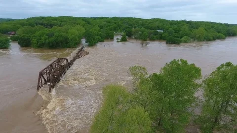 Aerial flight towards a flooded train bridge Stock Footage 75682539
