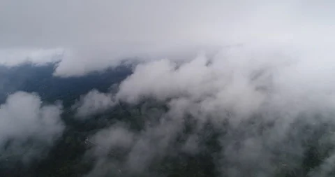 AERIAL. Flight trough clouds over the earth from an airplane Stock Footage 88070045