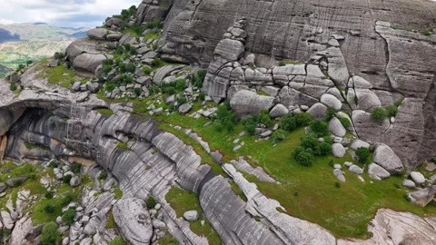 Aerial Flight Turning Left Beside Massive Rock Formation Stock-Footage 344332667