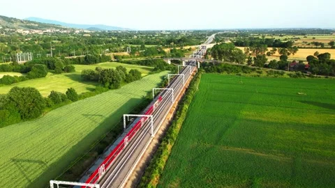 Aerial flight view pan out ETR 1000 Freccia Rossa Train-Railway Tuscany  Stock Footage 196493653