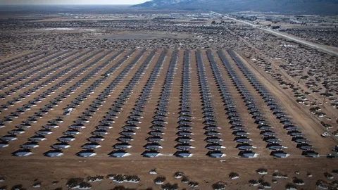 Aerial fly-by of Army Solar Panel Array in the desert Stock Footage