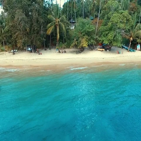 Aerial: Fly away from the wild beach. Stock Footage