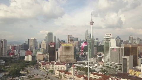 Aerial Fly back from flagpole on Merdeka and KL tower in Kuala Lumpur Malaysia Stock Footage 82156019