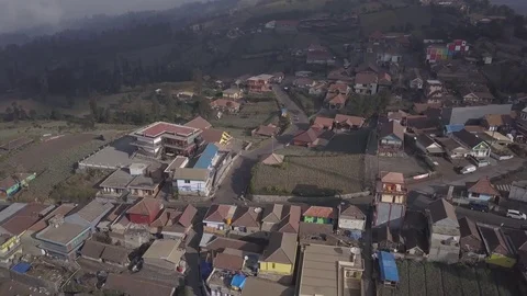 Aerial Fly back over Cemoro Lawang village in Bromo Java Indonesia 스톡 동영상 82192458