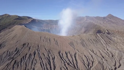 Aerial Fly back from smoking volcano in Bromo Java Indonesia Stock Footage 82248908