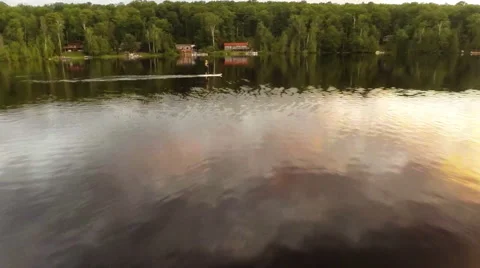 Aerial fly down a lake to SUP Boarder Vidéo 47742525