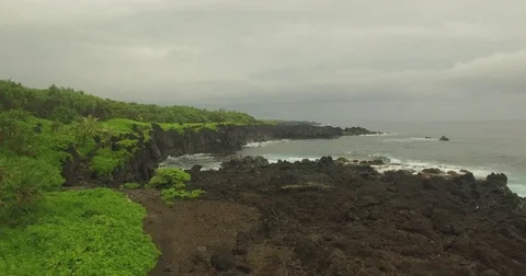 Aerial Fly Down Over Jagged Lava Rock Coast-line Stock Footage 75106619