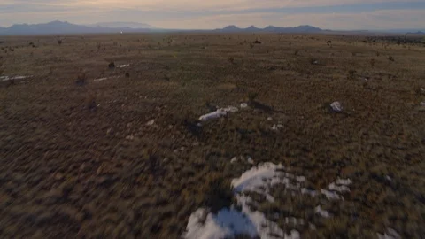 Aerial - Fly forward and tilt up from plains to vast view Stock Footage 101761971