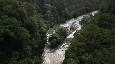 Aerial fly forward over view of Rio Barranca in Costa Rica in jungle dry season Stock Footage 329598593