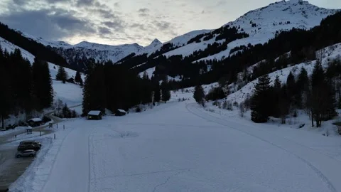 Aerial fly forward over winter mountains in Saalbach, Lengau Vídeos de archivo 329464875