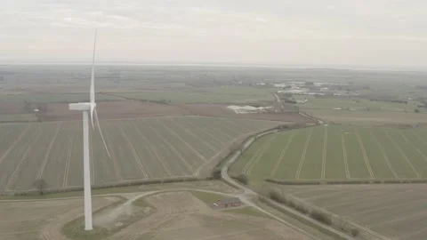 Aerial fly forward with spinning wind turbine on the left. 4K D-Log 動画素材 149978143