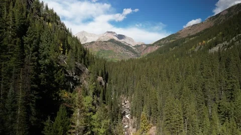 Aerial fly forward towards Capitol Peak in Elk Mountain Range in Colorado Stock Footage 251100111