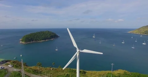 Aerial: Fly out from the windmill. Stock Footage 71680923