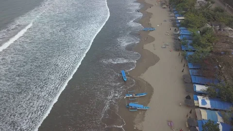 Aerial Fly over beach with waves and boats,Pangandaran,Java,Indonesia Stock Footage 106427345