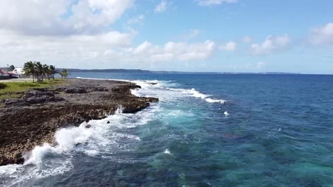 Aerial Fly Over | Cliffs and Waves on Caribbean Surfing Spot in Guadelopue Stock Footage 142242890