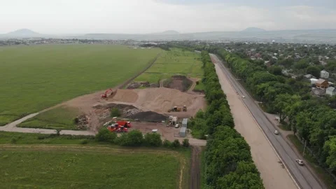 Aerial fly over the construction technique which produces repair work of road Stock Footage 147460861