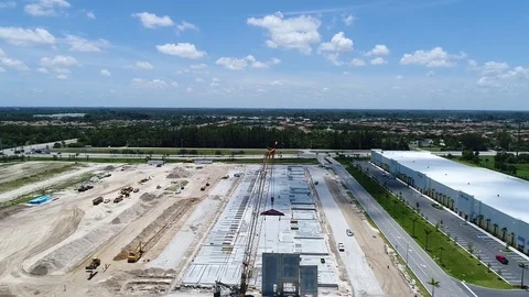 Aerial fly over a crane at a construction site Video stock 95015375