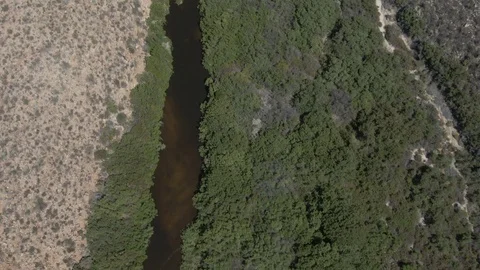 Aerial Fly Over Desert Desolate Green Valley and River Top View Close Up River Stock Footage 119448804