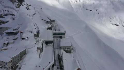 Aerial Fly Over Eigergletscher train station, Switzerland Stock Footage 151296366