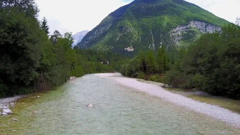 Aerial fly over Emerald river Soca and banks Stock Footage