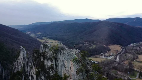 AERIAL: Fly Over Guy Standing on Seneca Rocks West Virginia Stock Footage 129789401