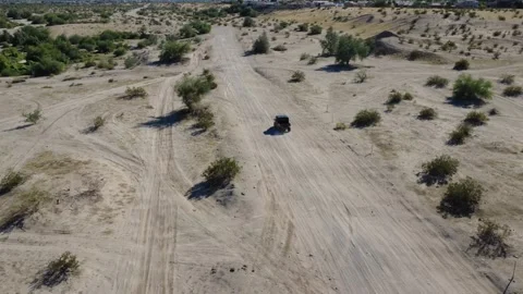 Aerial fly over Off roading Desert Trail with Polaris in Yuma, Arizona Stock Footage 323774068