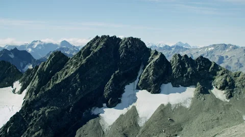 Aerial fly over sharp rocks and snow reveal Mt Cook Stock Footage 159044160