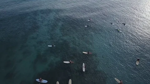 Aerial Fly Over Of Surfers Floating On Tropical Blue Sea Stock Footage 78657252