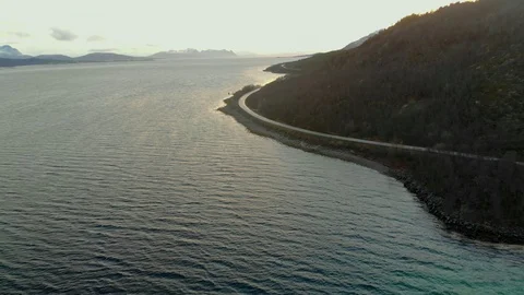 Aerial fly over tilted shot with view of islands and coastal road in northen Vídeos de archivo 126535890