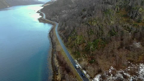 Aerial fly over tilted shot with view of islands and coastal road in northen Stockbeeldmateriaal 126540662