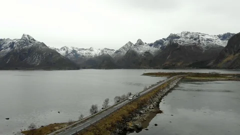 Aerial fly over tilted shot with view of islands and coastal road in northen Vidéo 126547025