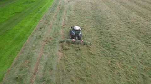 Aerial fly over of a tractor working in a field Stock Footage 276962526