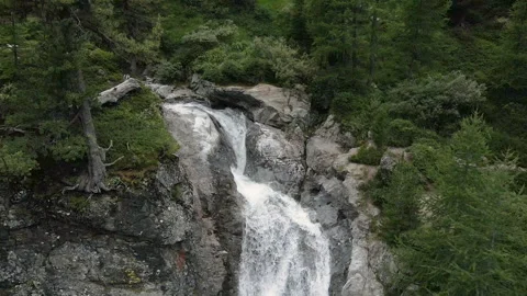Aerial fly over Val Nera mountain waterfall in Livigno Stock Footage 256208954