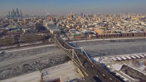 Aerial fly over view above river with ice of Moscow city center with bridge full Stock Footage 88333194