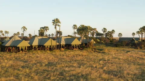 Aerial fly over view of the beautiful tented safari lodge Jack's Camp   Stock Footage 155725878