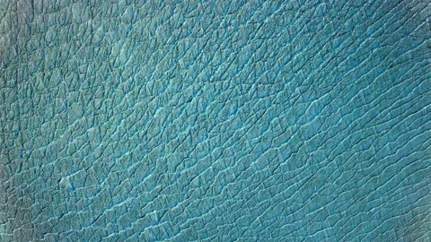 Aerial fly over view of cracked ice in the sea. Stock Footage 171813673