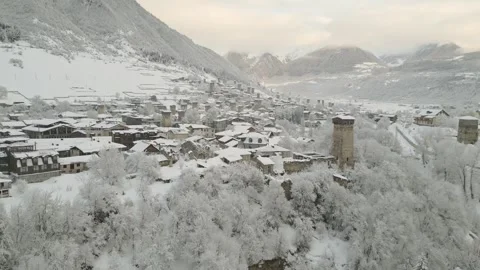 Aerial fly over view over scenic alpine ski town Mestia at sunset with hist.. Stock Footage 318308563