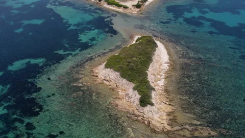 Aerial fly over view of small island with green trees Stock Footage 211828330