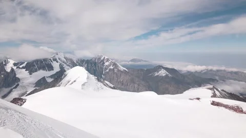 Aerial fly over view snowy caucasus mountains range from mount Kazbek saddl.. Stockbeeldmateriaal 285155587