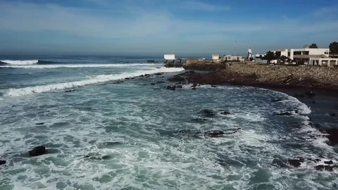 Aerial &amp; fly over view of some artificial rocky seashore of Baja California Video stock 112449014