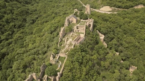 Aerial fly over view Ujarma Fortress. Ancient Hilltop Royal Citadel and Str.. Stock Footage 309034049