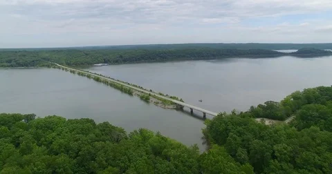 Aerial Fly By Split Road on Lake 스톡 동영상 76717948