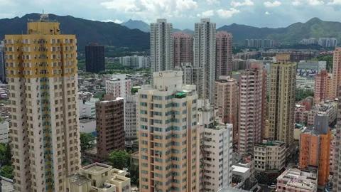 Aerial fly through dense residential high rise buildings in Yuen Long Hong Stock Footage 162997193
