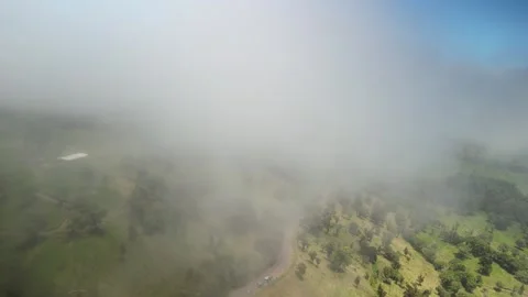 Aerial fly through low cloud layer in Costa Rica to total white with sunny sky Video stock 330210638
