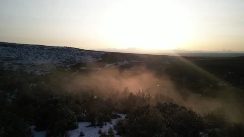 Aerial fly through mist in snow covered Fishlake National Forest in Utah Stock Footage 305364079